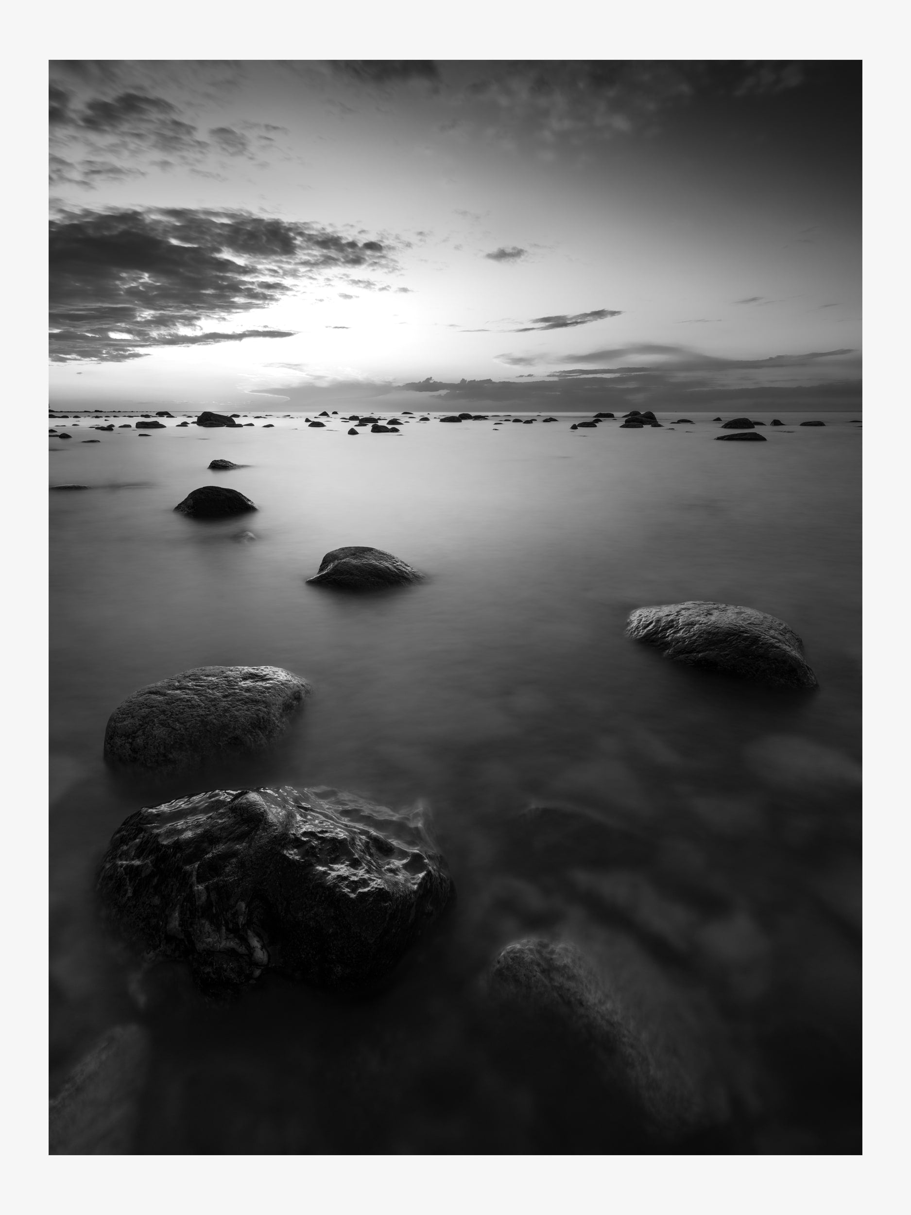 Black and White Seascape with Rocks and Sunset Sky