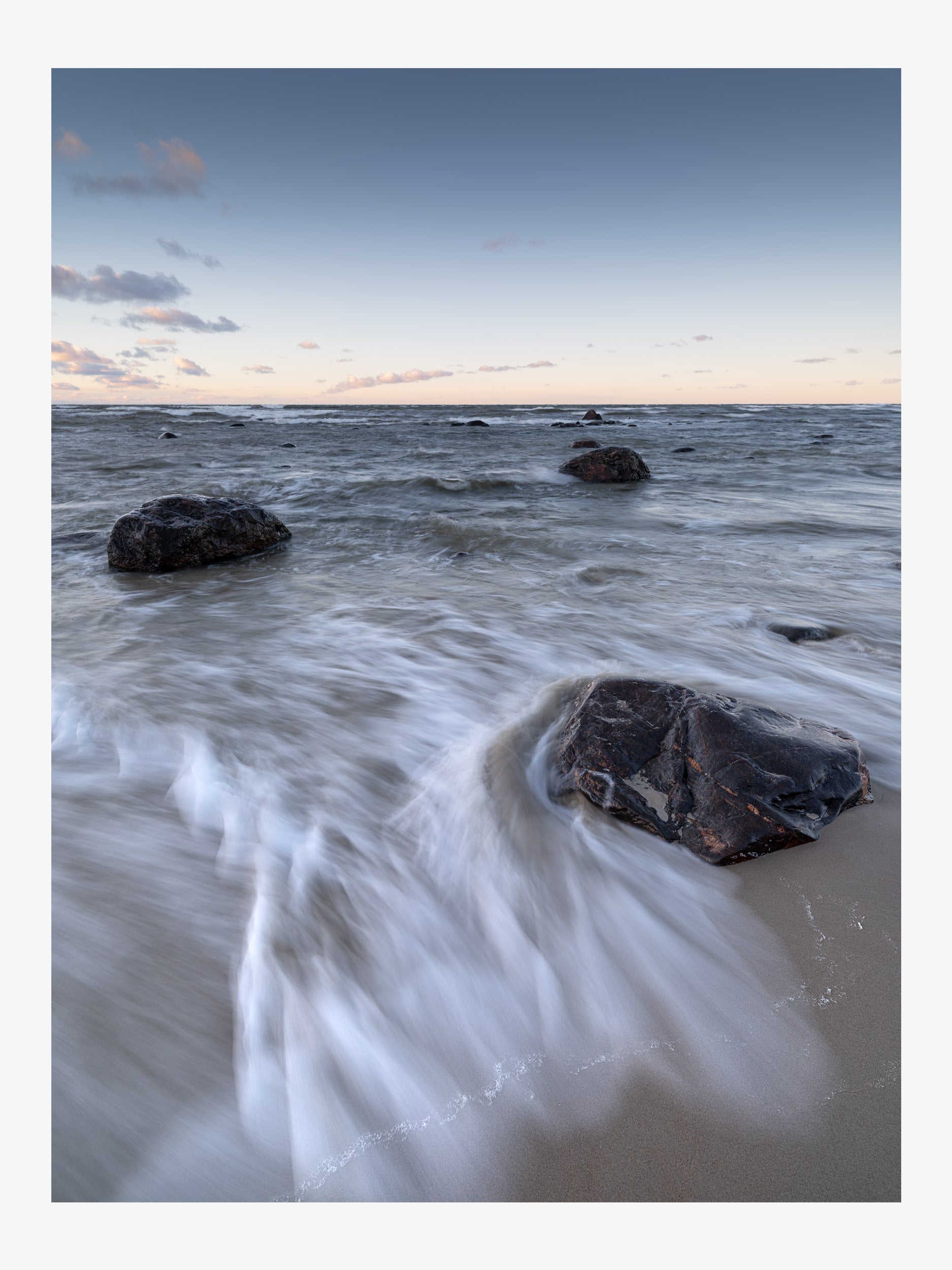 Sea Waves and Rocks on a Sandy Shore
