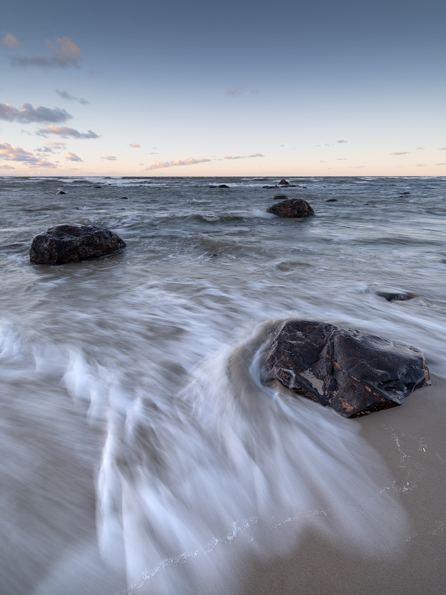 Sea Waves and Rocks on a Sandy Shore
