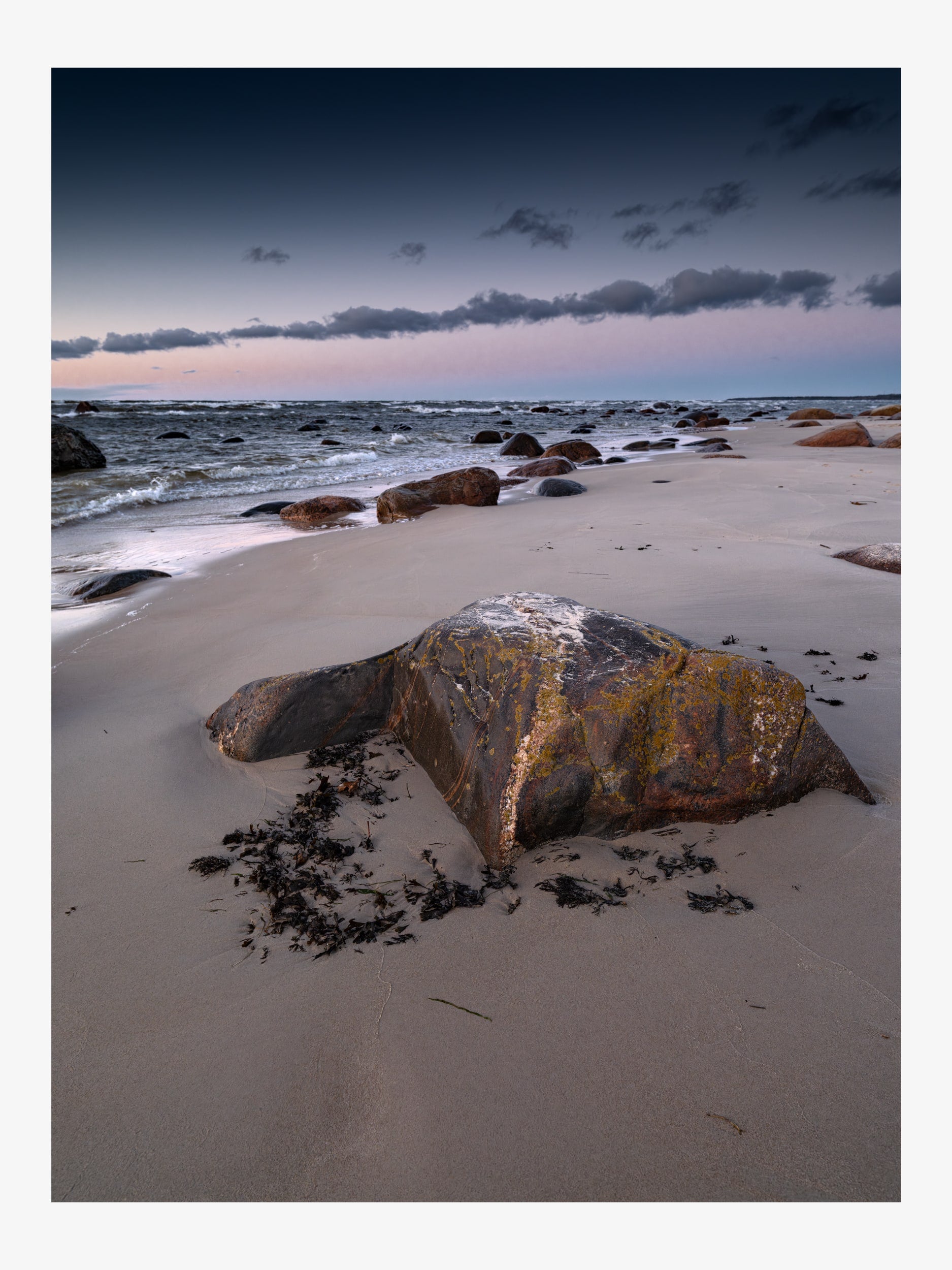 Rock on a Sandy Seashore in Evening Light