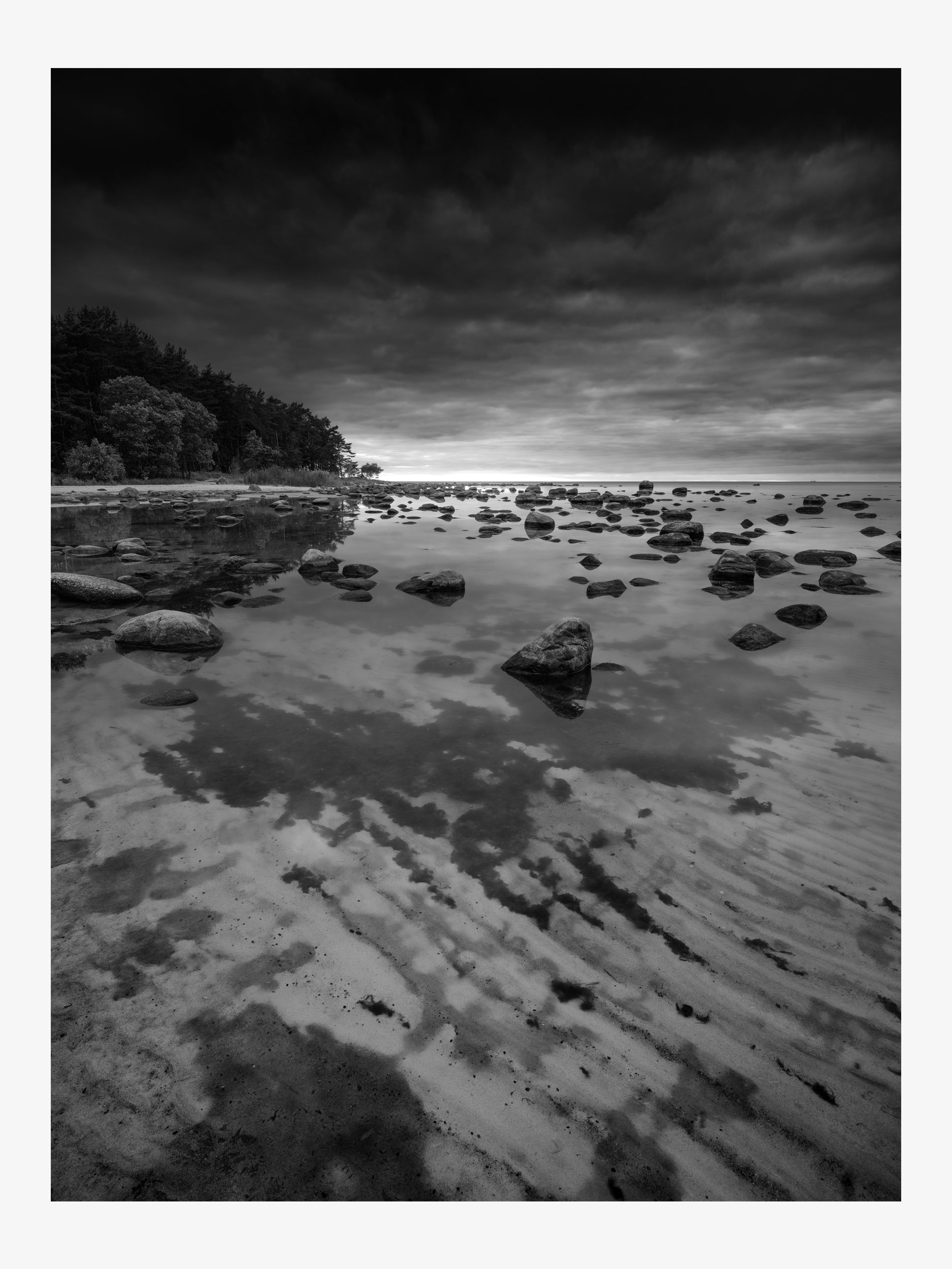 Coastal Stones under Cloudy Sky Fine Art Print