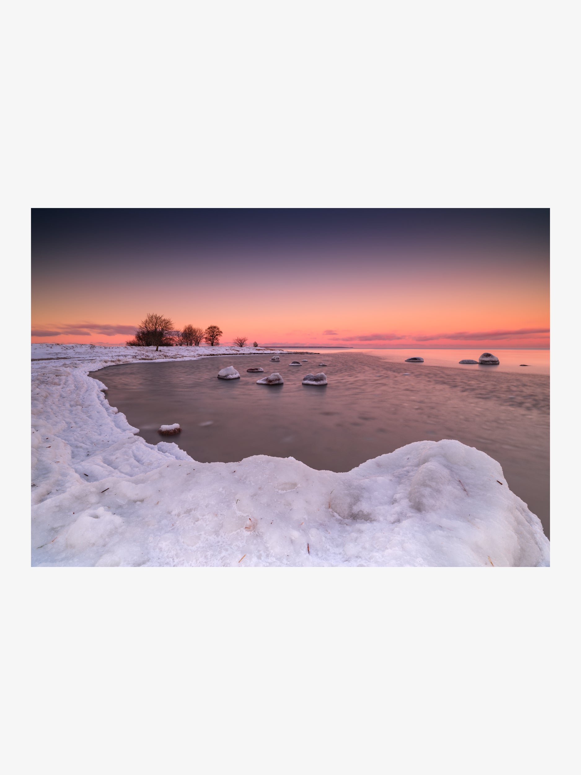 Winter Sunset on a Snowy Seashore