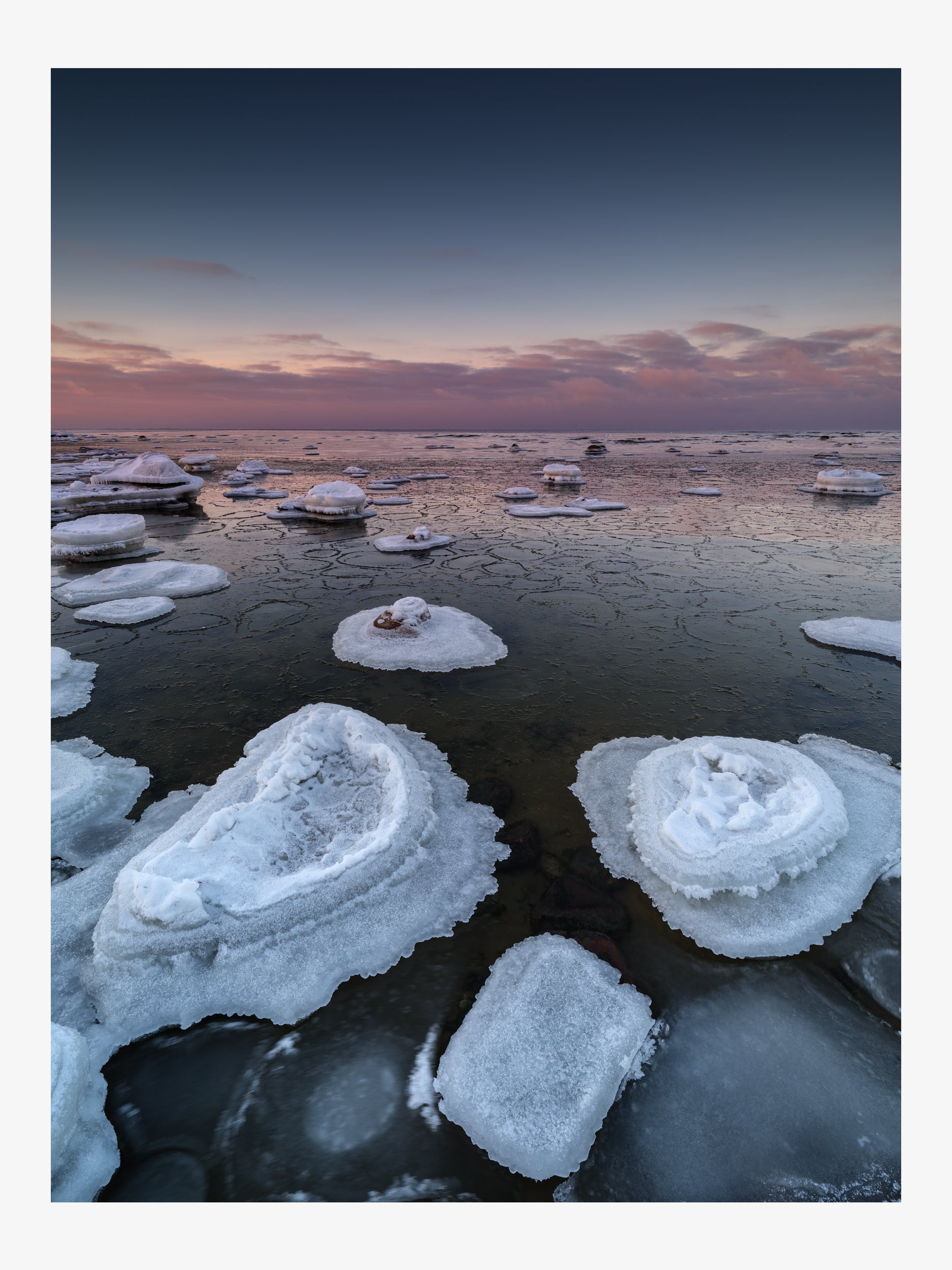 Ice-Covered Coastal Rocks at Twilight