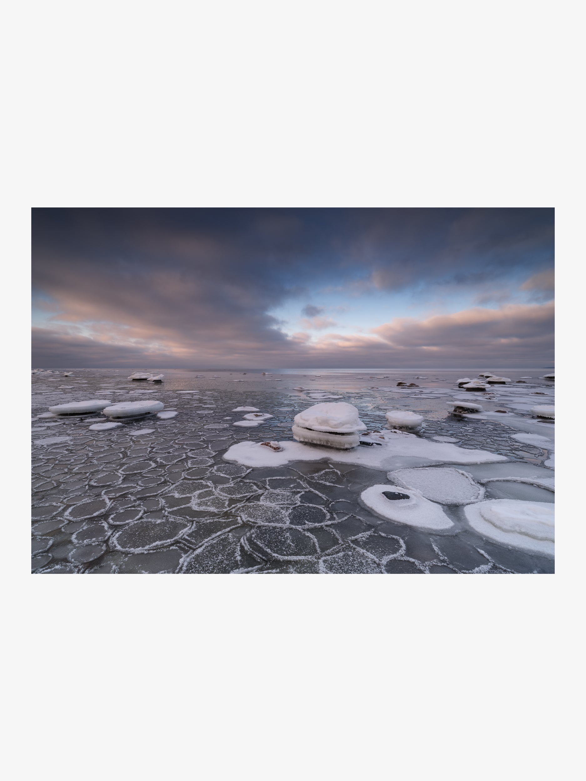 Cellular Ice Patterns on Shallow Water with Dramatic Cloudy Sky