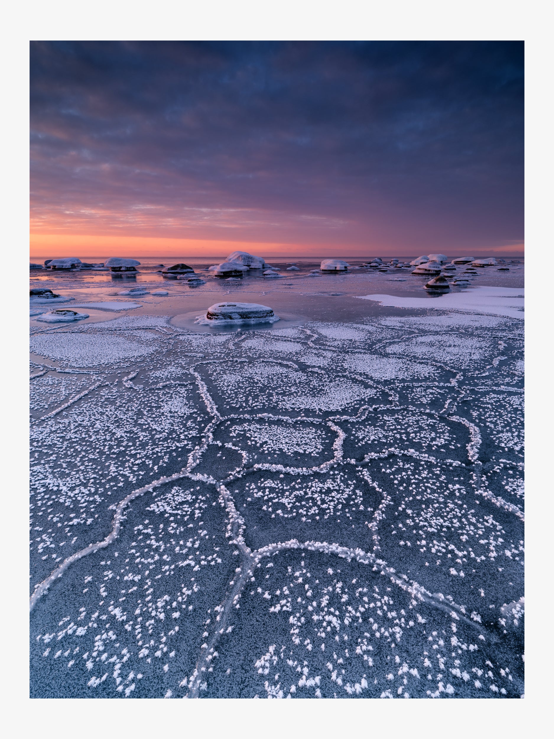 Snowy Coast at Sunset
