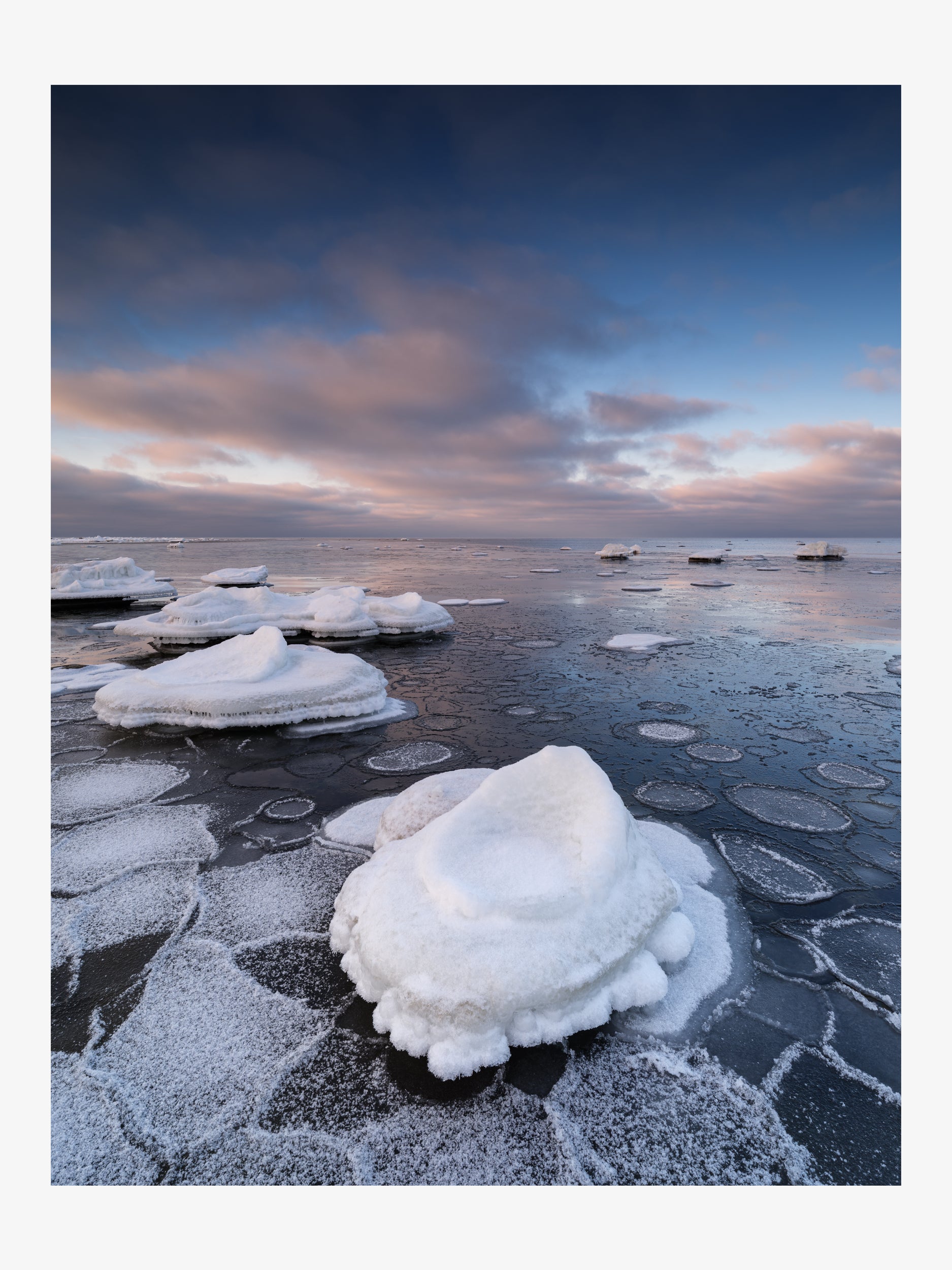 Icy Coast Under Pink Clouds