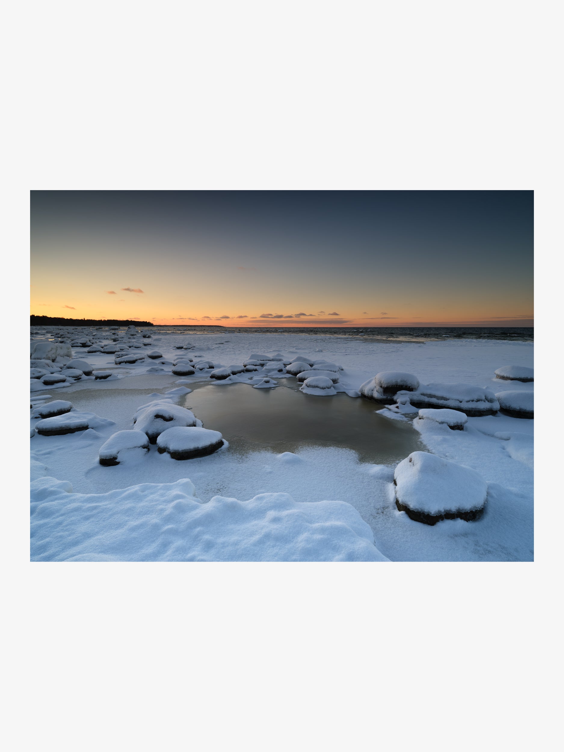 Snowy Shore at Sunset