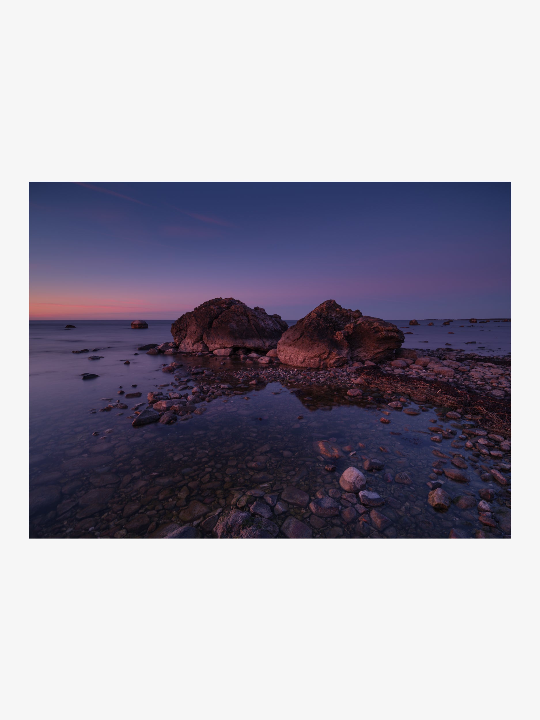 Two Boulders on a Rocky Shore at Blue Hour